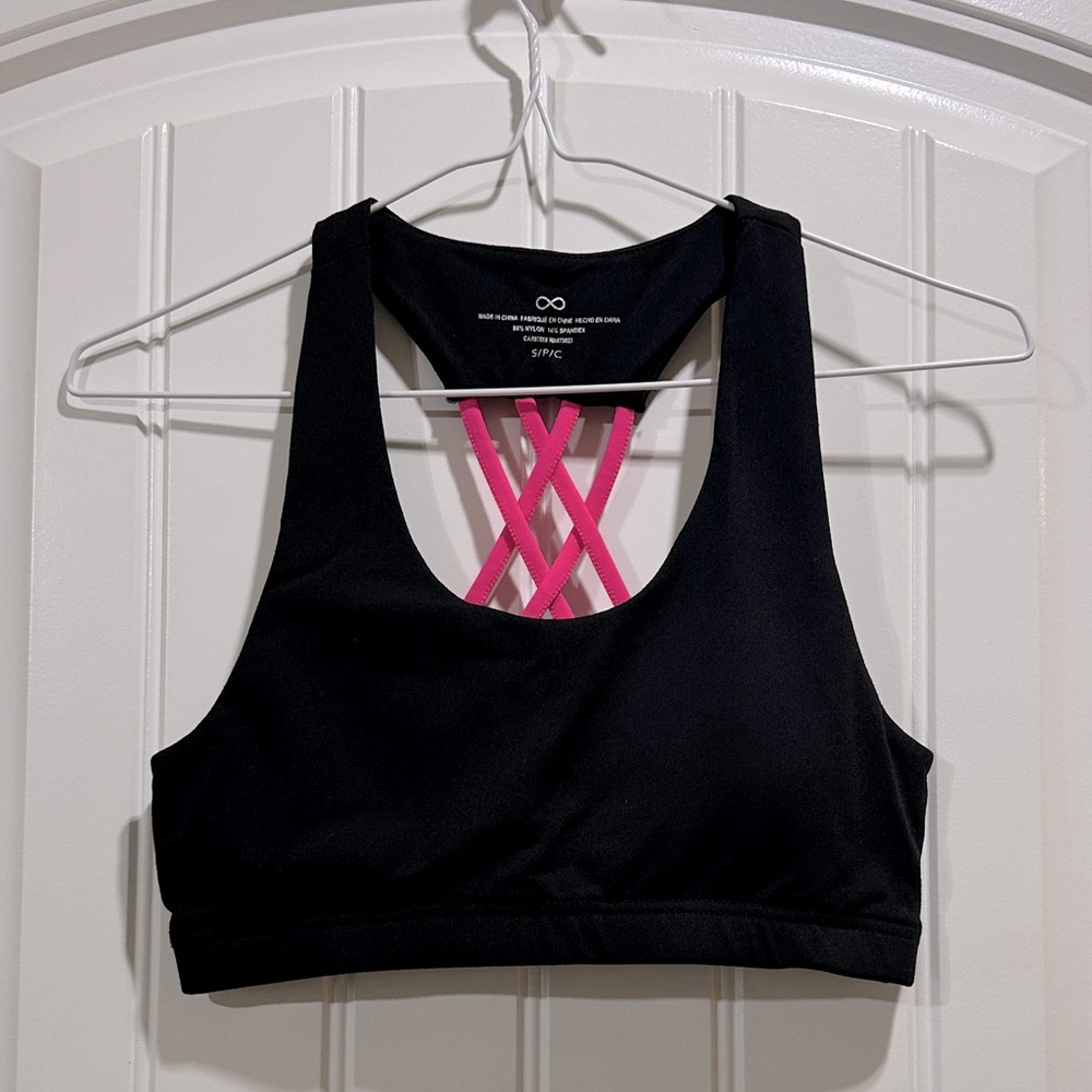 Sleek Black Sports Bra with Pink Accents